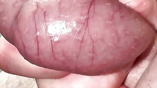 Close-up testicles massaging until big cumshot